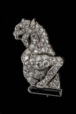 BROCHE en or gris 750/°°de forme dragon entièrement sertie de...