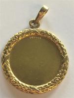 MEDAILLE Augis en or jaune 750/°°, diamants et rubis. PB:...