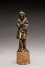 Personnage encapuchonné mangeant un potage en bronze.
XIXe siècle, dans le...