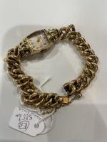 BRACELET MONTRE de dame en or jaune 585/°°. Poids brut...