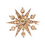 BROCHE "Etoile" en or jaune 750/°° sertie de diamants de...