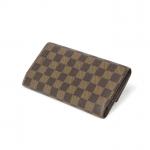 LOUIS VUITTON - PORTEFEUILLE en toile damier marron/ébène, agréments en...