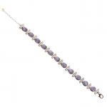 BRACELET en argent 925/°° orné de cabochons de tanzanite. L....