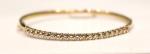 BRACELET "jonc" en or jaune 585/°° serti de vingt diamants...