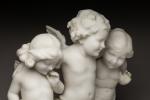 Guglielmo PUGI (c.1850-1915), Trois putti. Sujet en marbre de Carrare...