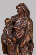 VIERGE à l'ENFANT en noyer sur console à cartouche et...