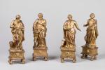 SCULPTURES en bois redoré figurant les quatre Évangélistes, posant sur...