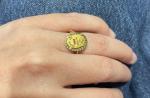 BAGUE "médaille Augis" en or jaune 750/°°, rubis synthétiques et...