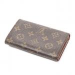 LOUIS VUITTON - PORTE MONNAIE "Porte-Tresor" en toile monogram, agréments...