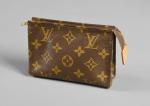 LOUIS VUITTON - Petite TROUSSE de toilette en toile enduite...