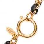 CHANEL - COLLIER en métal doré et cuir noir, le...