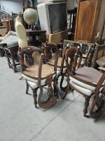 Une SUITE de six CHAISES en bois teinté acajou à...