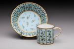 SEVRES, 1788. Petite tasse et sa soucoupe à décor sur...