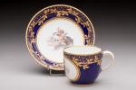 SEVRES. Tasse et sa soucoupe en porcelaine blanche à décor...