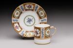 SEVRES, 1780. Tasse et soucoupe en porcelaine à fond blanc...