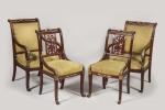 Deux FAUTEUILS et deux CHAISES en acajou et bronze doré,...