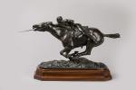 Edmond DRAPPIER (XIXème - XXème siècle). Cavalier chargeant. Bronze à...