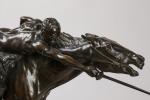 Edmond DRAPPIER (XIXème - XXème siècle). Cavalier chargeant. Bronze à...