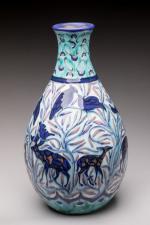 Jean Mayodon (1893-1967)
Vase piriforme en faïence polychrome à décor d'animaux...