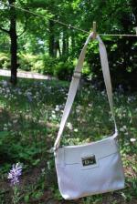 Christian DIOR. Sac en toile siglée et cuir blanc, fermeture...