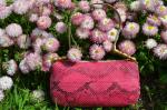 Christian DIOR. Sac Malice en vachette rose et python fuchsia,...