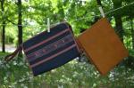 YVES SAINT LAURENT, LANCEL. Lot comprenant une pochette en toile...