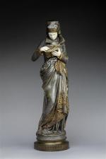 Ernest CARRIER-BELLEUSE (1824-1887) "Liseuse". Bronze à patine polychrome et ivoire....